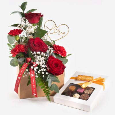 Love Letter with Chocs
 - Send a message straight from your heart with this delightful envelope arrangement of romantic flowers accompanied by delicious chocolates.
