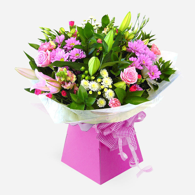 Ashleigh - A budding delight, complimented by greenery and presented in a gift box/bag. Beautiful flower bouquet hand delivered by the local florist.