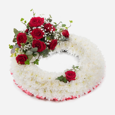 Wreath SYM-314 - White Massed Wreath with Red Rose Spray. A classic arrangement to send for a funeral. 