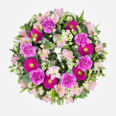 Wreath SYM-320 - Classic Wreath in Shades of Pink. A classic and beautiful arrangement to send for a funeral. 